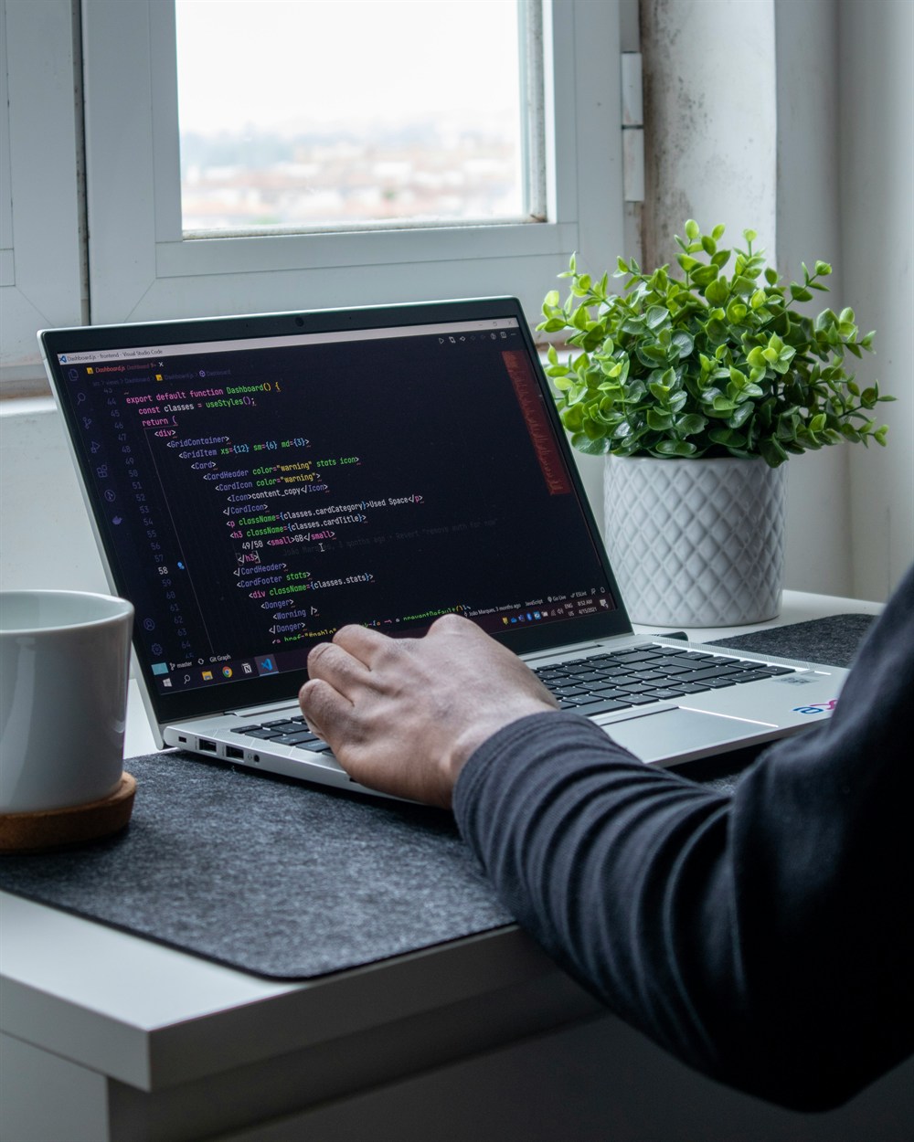Developer coding on a computer workstation