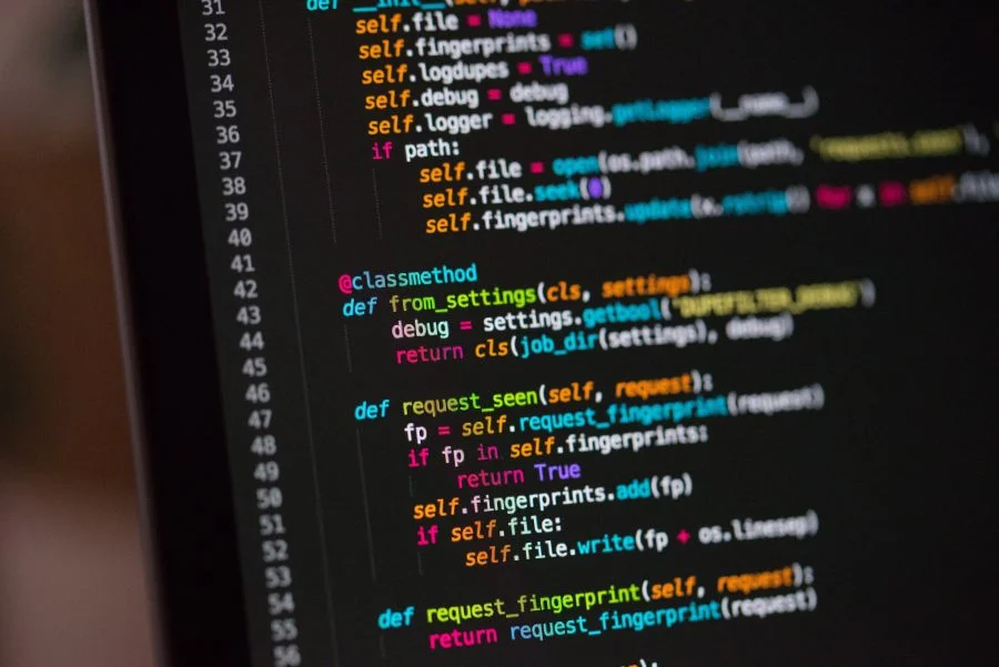 Coding setup with multiple colorful screens